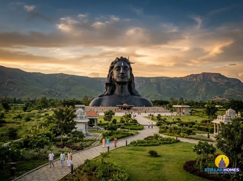 The towering Adiyogi Shiva statue rising above a landscaped courtyard at Sadhguru's Isha Foundation sannidhi near Chikkaballapur