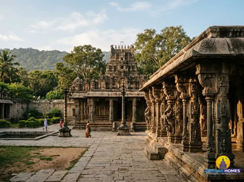 Ornate stone gopuram and pillared mandapa of the historic Bhoga Nandeeshwara Temple complex at the foothills of Nandi Hills